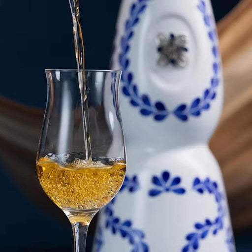 Clase Azul Premium Reposado Tequila amber liquid tequila poured into glass 