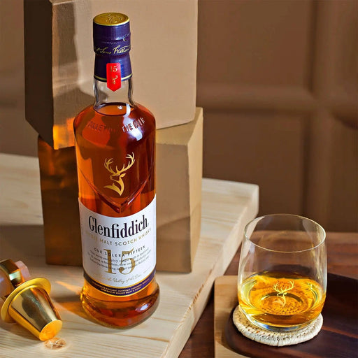 Glenfiddich 15 single malt scotch whisky bottle and glass served neat
