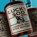 Lucky Sod Irish Whisky Liqueur, 70cl blends dark Irish whiskey with notes of velvety vanilla, sticky toffee, and sweet caramel close up of the label