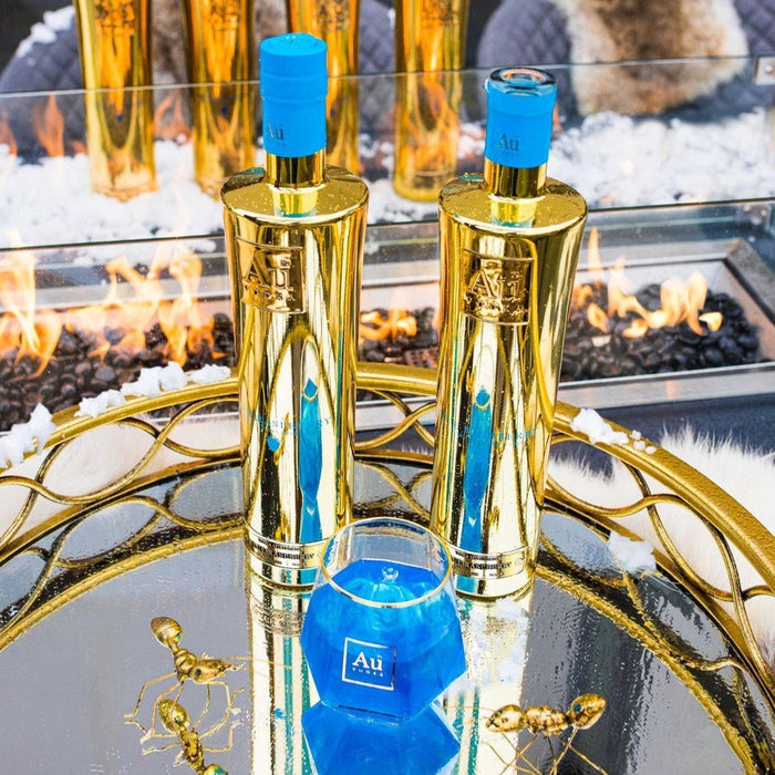 Au Vodka Blue Raspberry Gold Bottle with glass by celebrity charlie sloth.