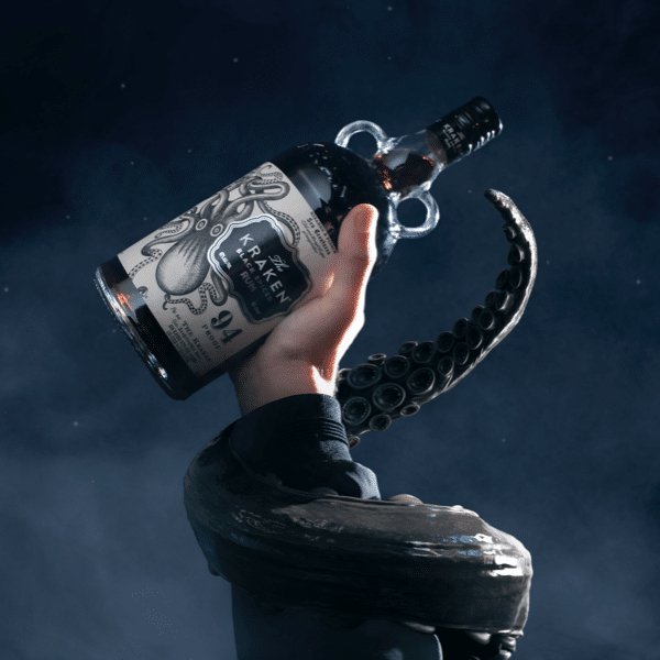 Kraken black spiced rum bottle held in hand with kraken wrapped around wrist